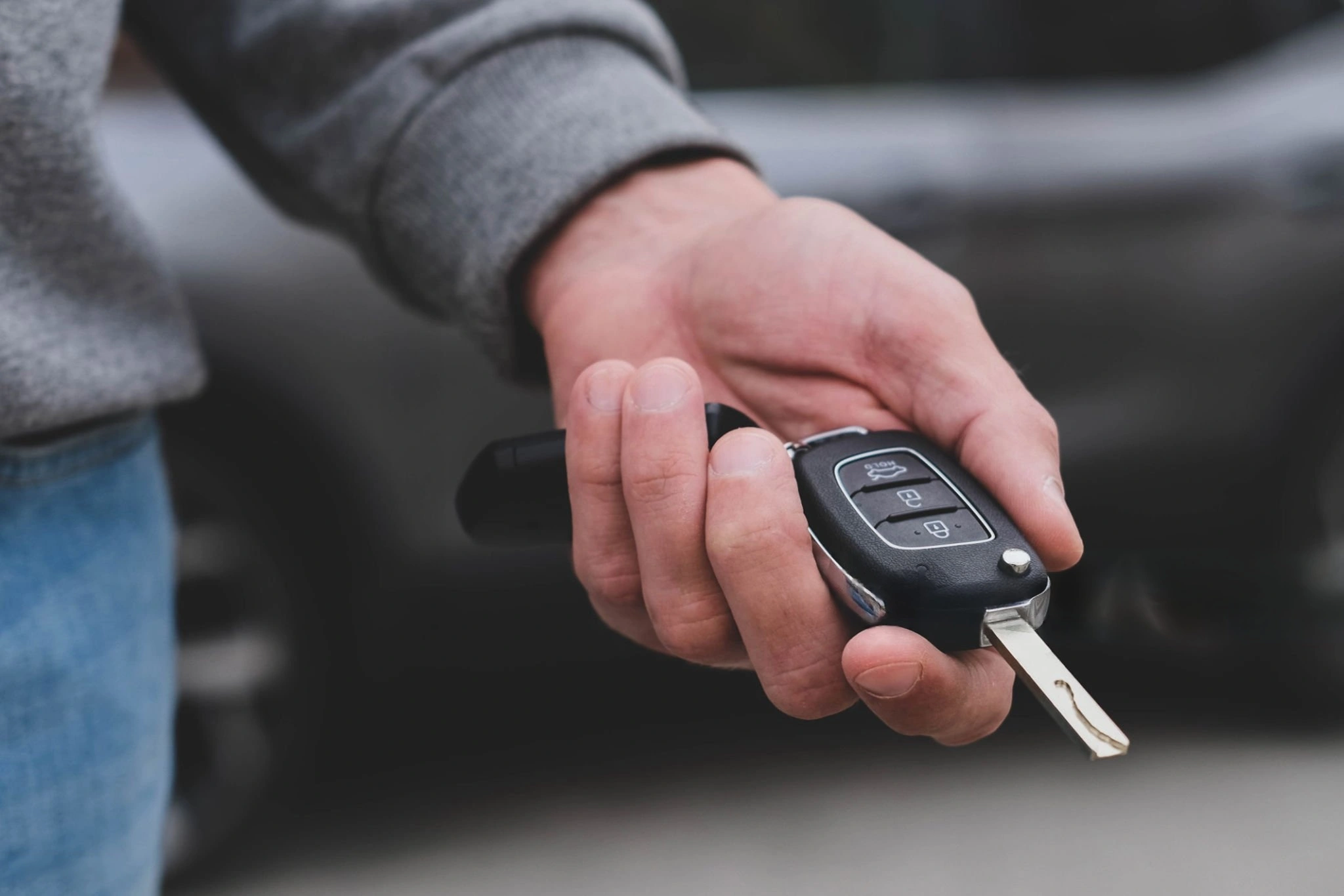 Hand holding car keys